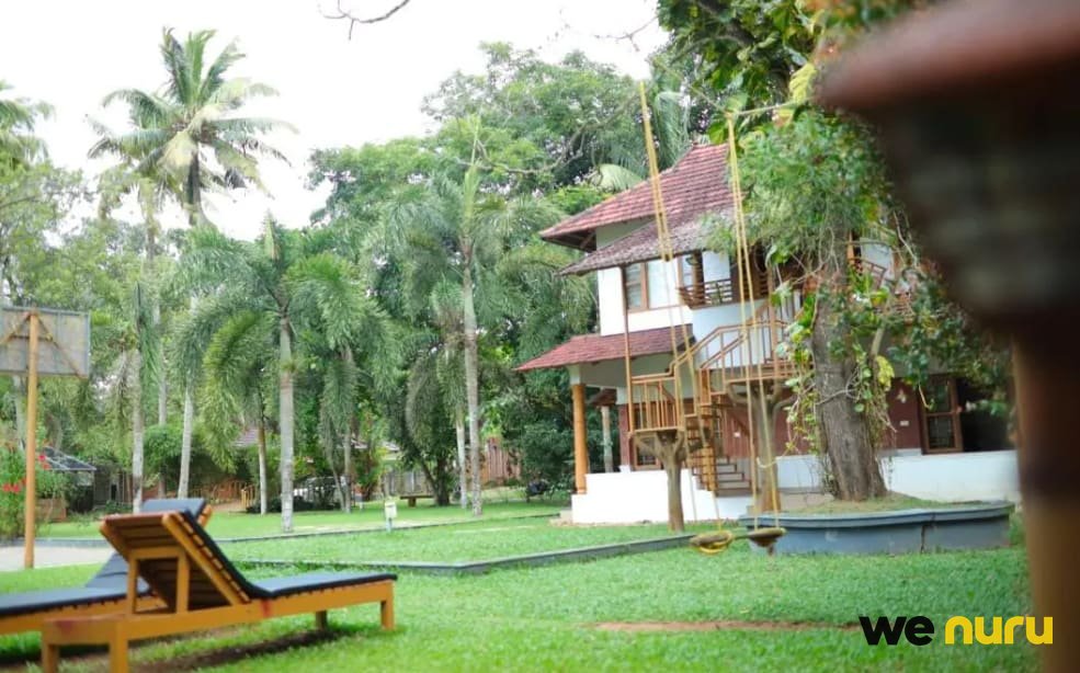 Tropical Garden with Kerala-Style Villa Exterior, Palm Trees & Open Lawns – Alappuzha, Kerala — farmhouse in Alappuzha